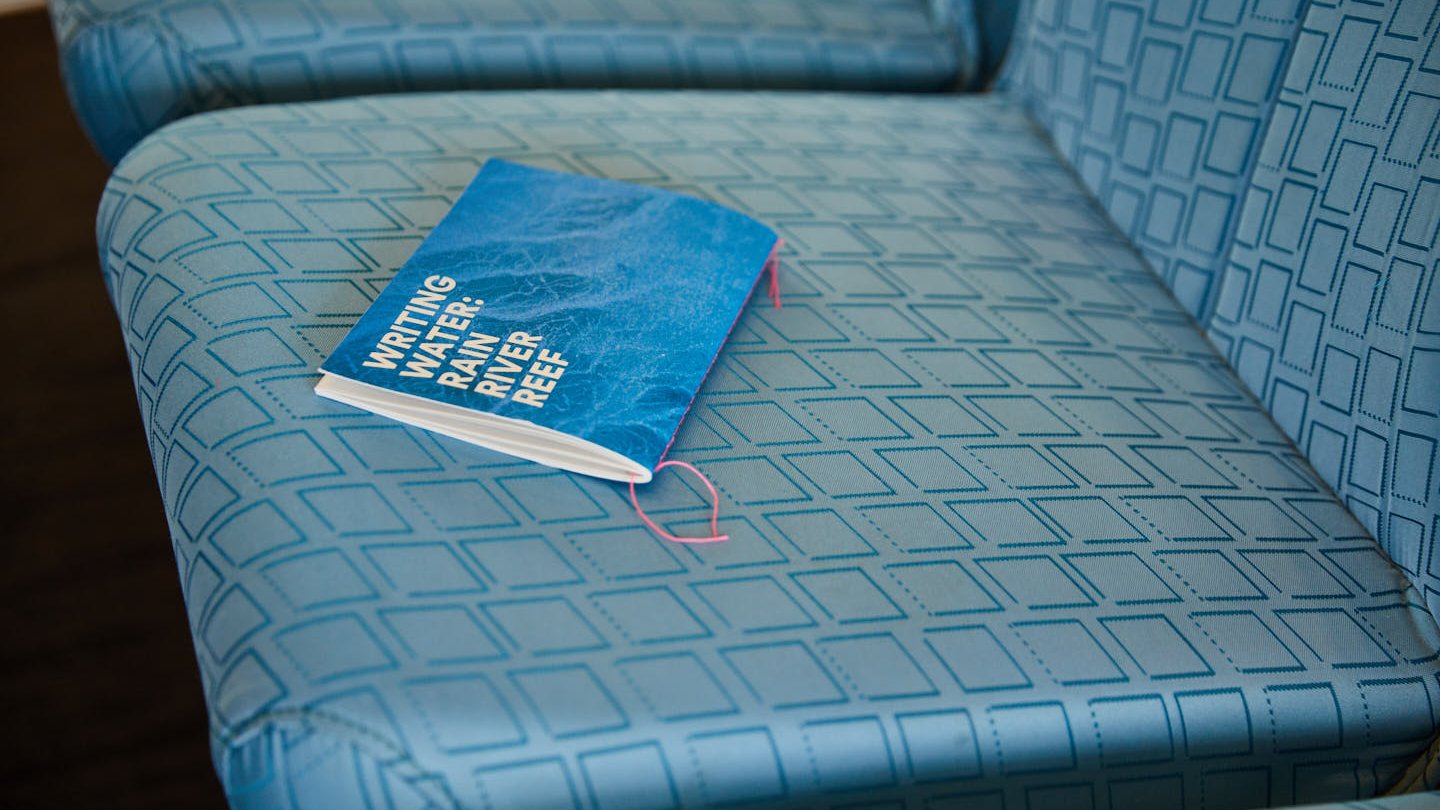 Writing Water-Sydney Ferry-chapbook on seat-Red Room Poetry.jpg